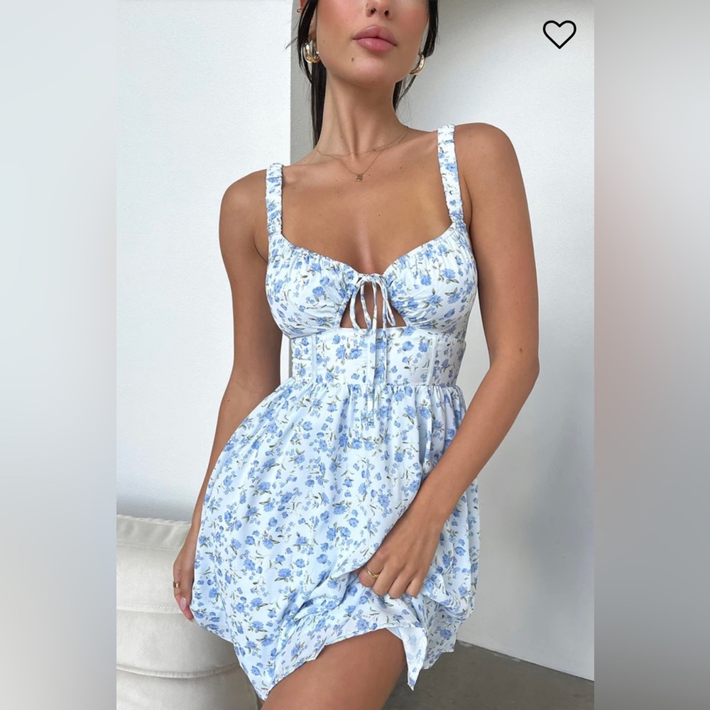 The prettiest floral of the season! Flowy fit, ruched stretchy shoulder straps.